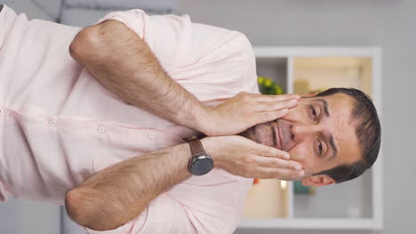 Vertical-video-of-Tired-looking-man.